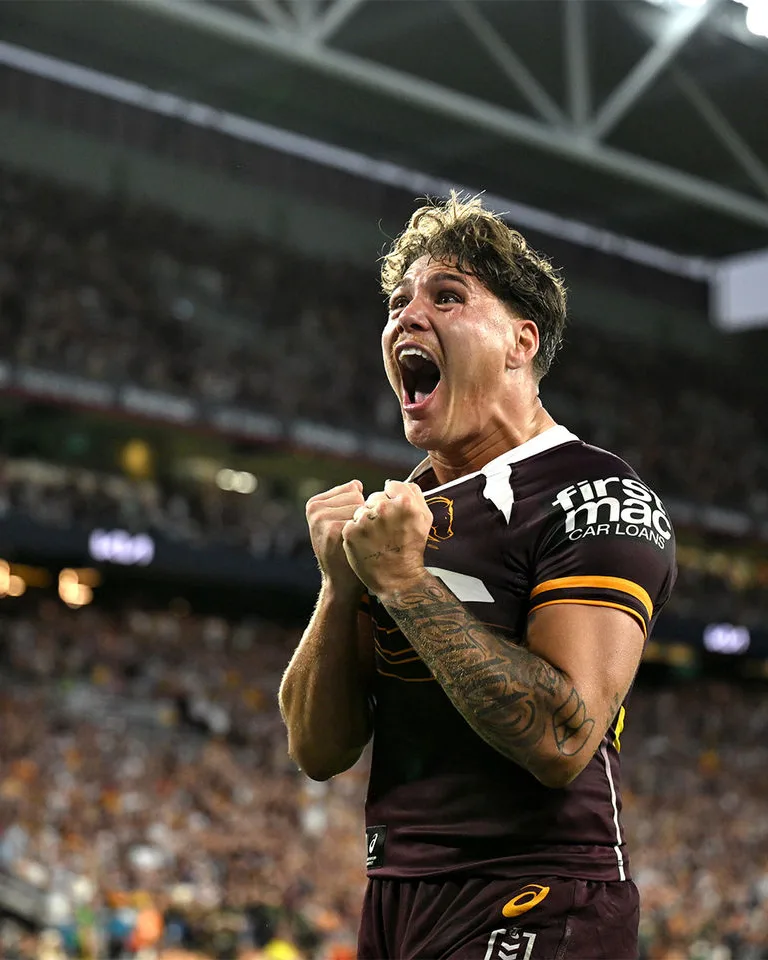 Brisbane Broncos player celebrating at a home game